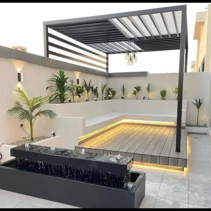 Stylish pergolas, raised seating decks, and cascading water features from Plants House Gardening, set in a lush outdoor garden space.