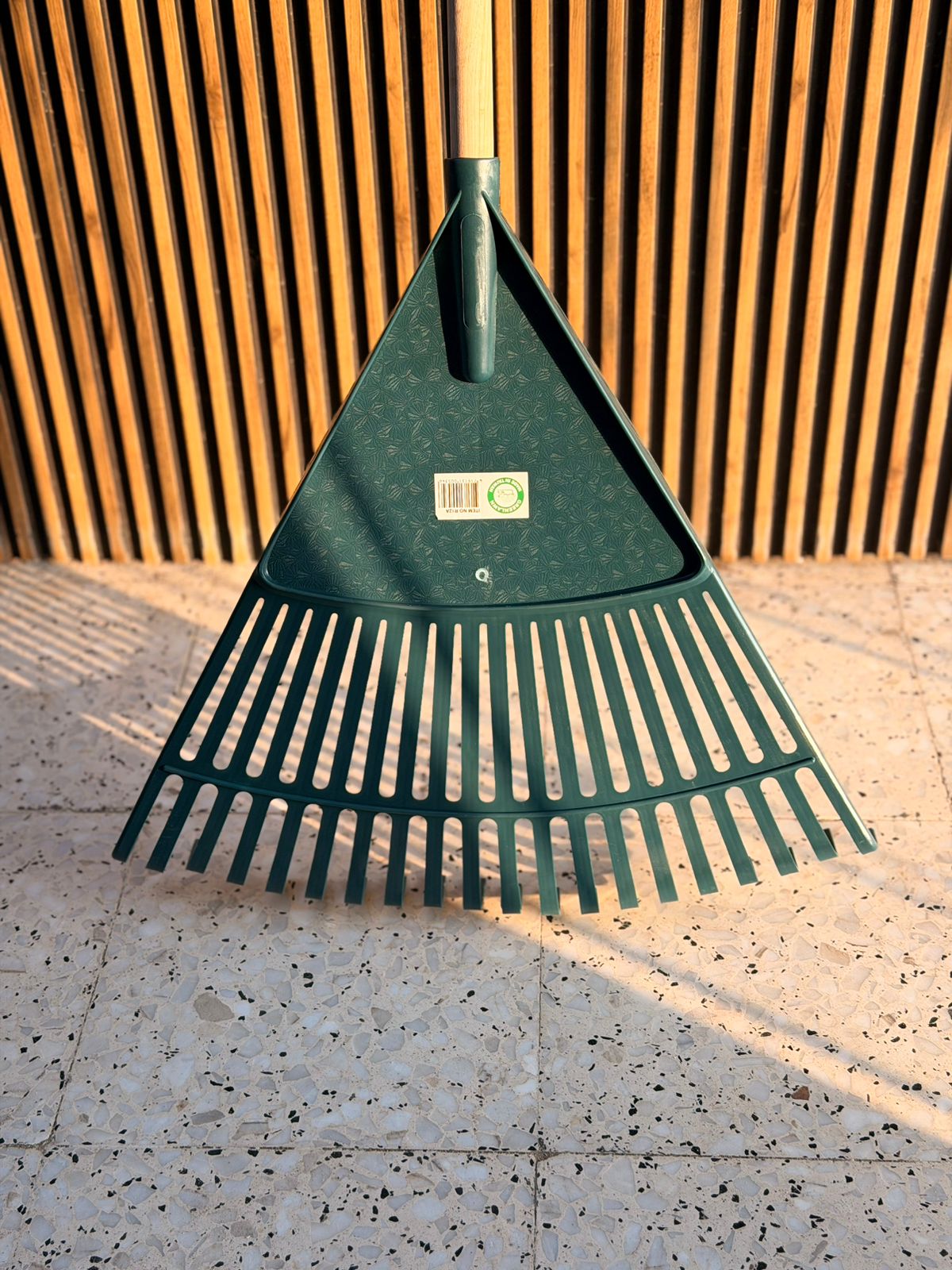 Plant House garden rake for planting, with metal tines and wooden handle, suitable for garden soil and plant bed preparation.