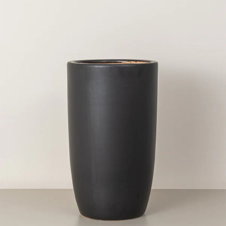 Medium tall black cremic plant pots by Plant House, featuring smooth, matte finish perfect for indoor or outdoor plants.