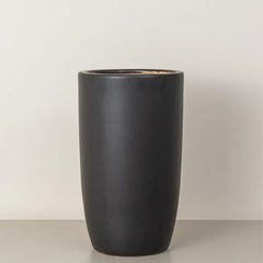 Medium tall black cremic plant pots by Plant House, featuring smooth, matte finish perfect for indoor or outdoor plants.