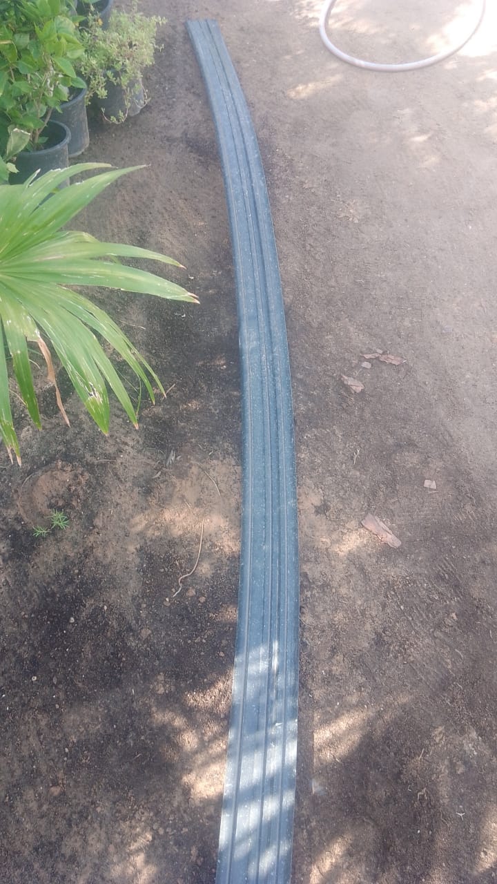 Black plastic grass edging strip, 5 meters long, from Plants House Gardening Work LLC, used for garden border separation.
